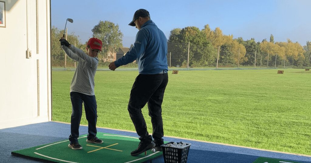 Artie Atwal on driving range.