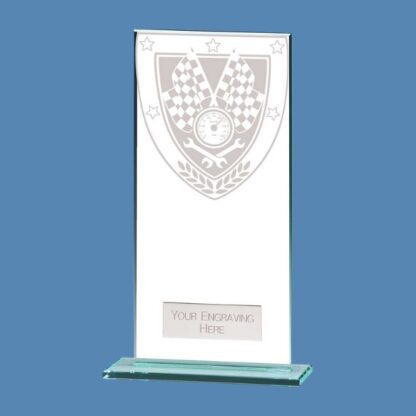 The Millennium Motorsport Jade Glass Award is available to buy in five sizes from Fen Regis Trophies, making for a cost-effective yet stylish piece to recognise any deserving driver. The plaque features a graphic consisting of chequered flags, speedo, and spanners in amongst a shield. Our experienced in-house team will personalise this jade glass award by engraving your wording of choice onto the attached metal plate. The plate will be placed towards the bottom of the face of the plaque, just above the base. Millennium Motorsport Jade Glass Award For 50 years, our in-house team have been supplying and engraving motorsport trophies and awards for clubs up and down the country. With more than 600 five-star reviews on Trustpilot, our reputation speaks for itself. The available sizes are: Size One – 4.25” (11cm) tall Size Two – 5” (12.5cm) tall Size Three – 5.5” (14cm) tall Size Four – 6.25” (16cm) tall Size Five – 7” (18cm) tall Please get in contact with a member of our team today if you would like any more information on this product.